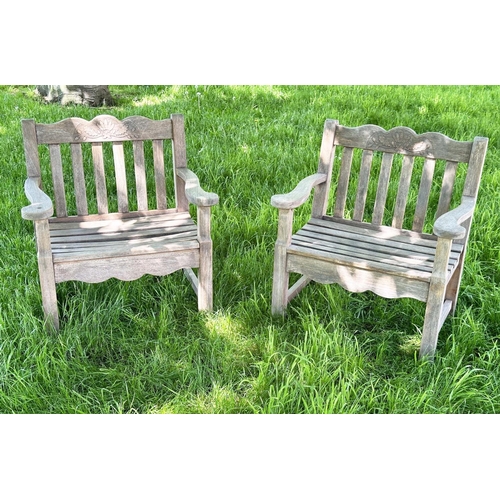 135 - GARDEN ARMCHAIRS BY BRIDGMAN & CO LTD, a pair, well weathered teak with generous seats, slatted back... 