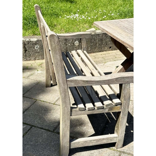 140 - GARDEN SET BY WOODFERN, well weathered teak with substantial X frame table, 72cm H x 152cm W x 86cm ... 