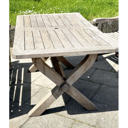 140 - GARDEN SET BY WOODFERN, well weathered teak with substantial X frame table, 72cm H x 152cm W x 86cm ... 