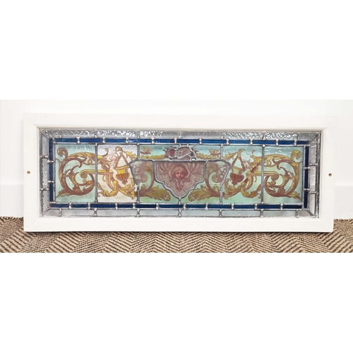 182 - STAINED GLASS PANEL, mask and foliate scroll design in painted frame, 35cm H x 91cm.