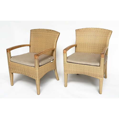 127 - TERRACE/GARDEN ARMCHAIRS BY GLOSTER, a pair, all weather rattan woven and teak framed with cushions,... 