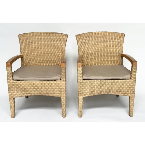 127 - TERRACE/GARDEN ARMCHAIRS BY GLOSTER, a pair, all weather rattan woven and teak framed with cushions,... 