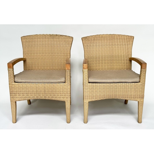 127 - TERRACE/GARDEN ARMCHAIRS BY GLOSTER, a pair, all weather rattan woven and teak framed with cushions,... 