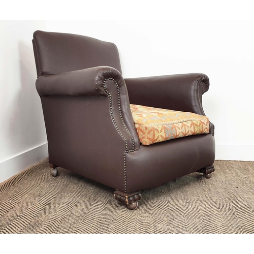 172 - CLUB ARMCHAIR, early 20th century oak in brown leatherette with kilim seat cushion and modern castor... 