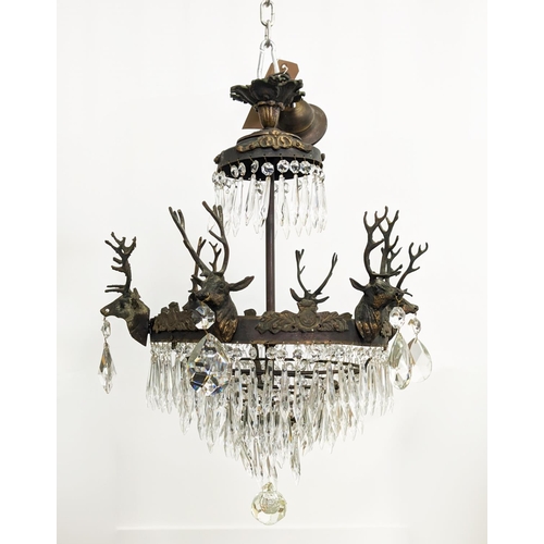 176 - CHANDELIER, gilt metal with stag heads, glass drops and six lights, 53cm W x 85cm H overall.