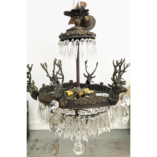 176 - CHANDELIER, gilt metal with stag heads, glass drops and six lights, 53cm W x 85cm H overall.