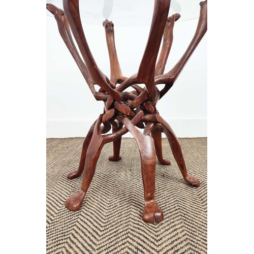 255 - OCCASIONAL TABLE, hardwood with circular glass top on intertwined camel outline supports, 62cm H x 6... 