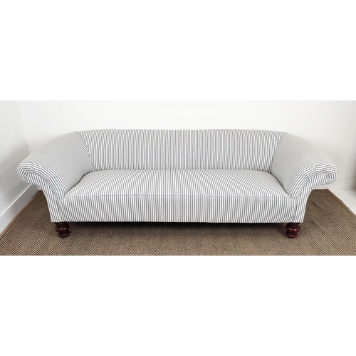 256 - CHESTERFIELD SOFA, Victorian design mahogany in new ticking on turned feet, 63cm H x 217cm x 84cm.