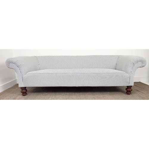 256 - CHESTERFIELD SOFA, Victorian design mahogany in new ticking on turned feet, 63cm H x 217cm x 84cm.