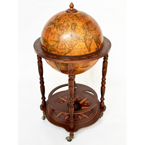 293 - GLOBE COCKTAIL CABINET, in the form of an antique terrestrial globe on stand with rising lid and fit... 