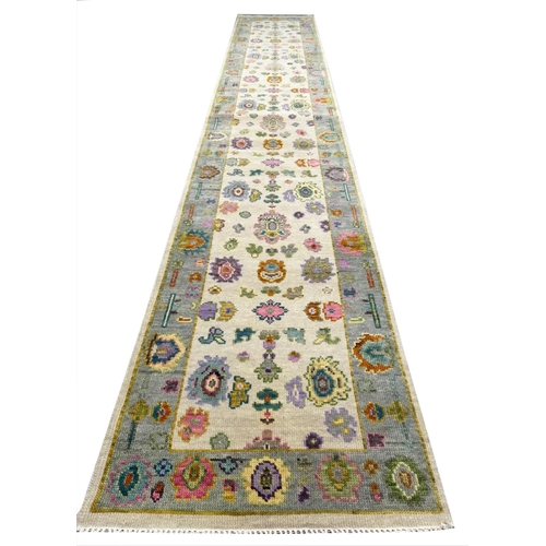 82 - CONTEMPORARY OUSHAK LONG RUNNER, 442cm x 76cm.