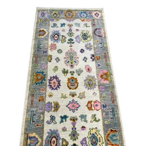 82 - CONTEMPORARY OUSHAK LONG RUNNER, 442cm x 76cm.