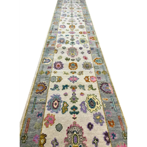 82 - CONTEMPORARY OUSHAK LONG RUNNER, 442cm x 76cm.