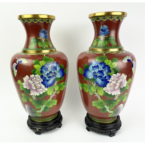 27 - CLOISONNE VASES, a pair, 20th century Chinese with red ground and floral butterfly decoration on ope... 