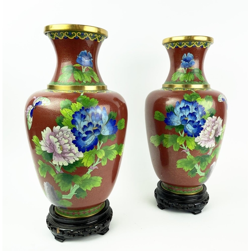 27 - CLOISONNE VASES, a pair, 20th century Chinese with red ground and floral butterfly decoration on ope... 