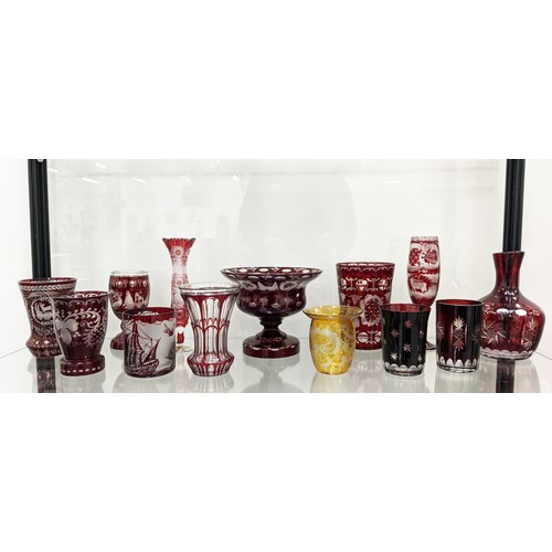 10A - QUANTITY OF BOHEMIAN CUT GLASS, mostly red, comprising various drinking glasses, bowls, water jug an... 