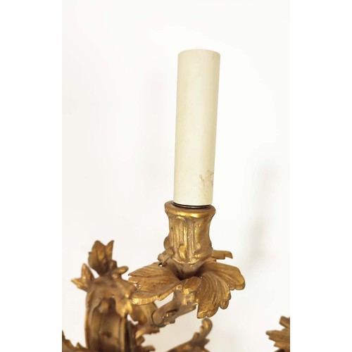 30 - WALL LIGHTS, four, Rococo style gilt metal each with three branches, 65cm H. (4)