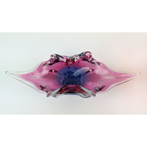 2 - A BOHEMIAN GLASS PINK AND INDIGO CENTREPIECE BOWL, in the form of a stylised leaf, flared edges, 10c... 