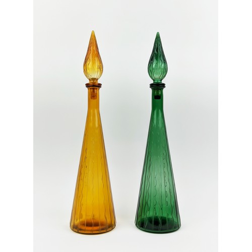 3 - A PAIR OF ITALIAN STYLE DECANTERS, of conical form, one in green, the other in amber, each measuring... 