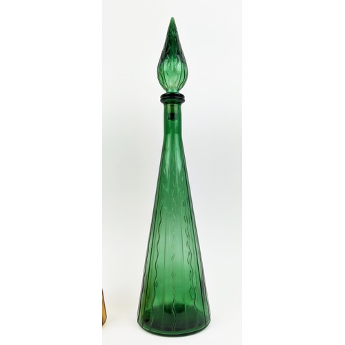 3 - A PAIR OF ITALIAN STYLE DECANTERS, of conical form, one in green, the other in amber, each measuring... 