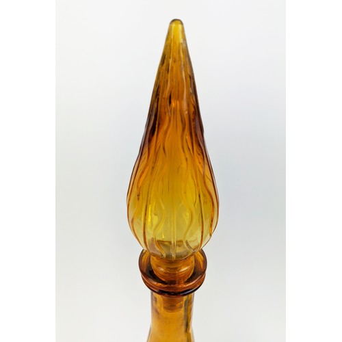 3 - A PAIR OF ITALIAN STYLE DECANTERS, of conical form, one in green, the other in amber, each measuring... 