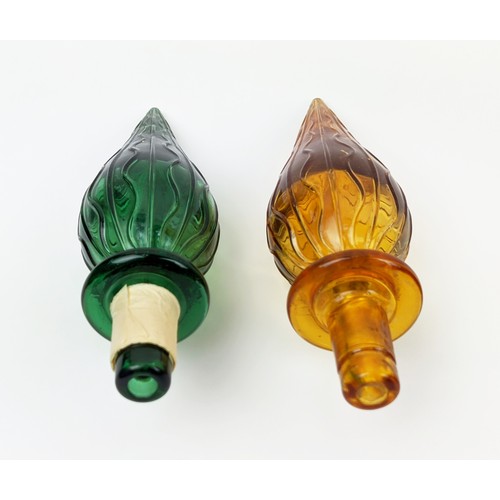 3 - A PAIR OF ITALIAN STYLE DECANTERS, of conical form, one in green, the other in amber, each measuring... 