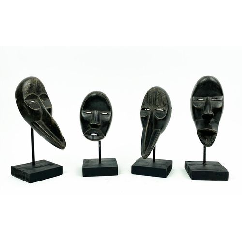 16 - SET OF FOUR DAN MASKS (Ivory Coast), 30cm H.