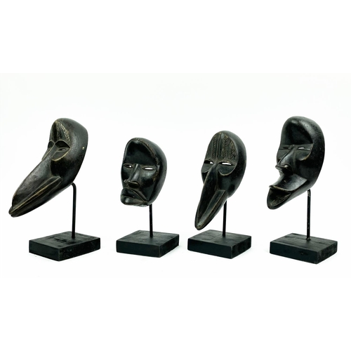 16 - SET OF FOUR DAN MASKS (Ivory Coast), 30cm H.