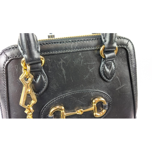 23 - GUCCI 1955 HORSEBIT MINI TOP HANDLE BAG, black leather with gold tone hardware, fabric lining, all a... 