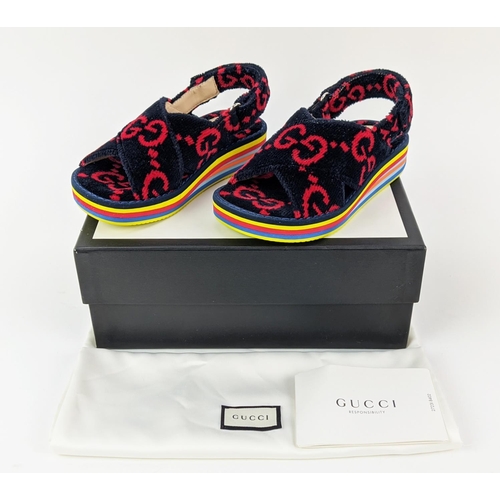 44 - GUCCI CHILDREN TOWELLING SANDALS, monogrammed, with slingback velcro strap closure, rubber rainbow s... 