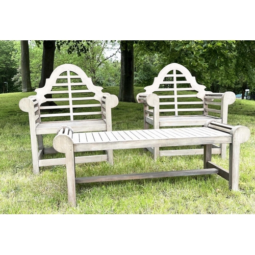 102 - LUTYENS STYLE GARDEN ARMCHAIRS AND TABLE, a pair, well weathered teak with companion low table all a... 