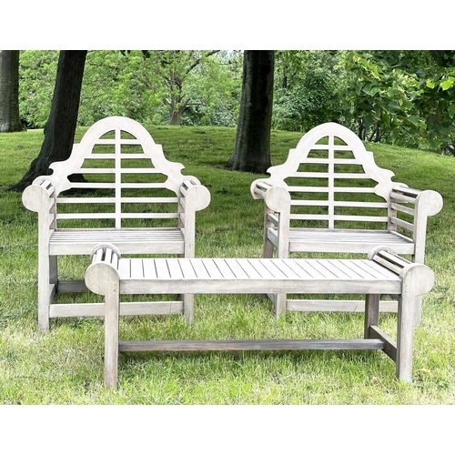 102 - LUTYENS STYLE GARDEN ARMCHAIRS AND TABLE, a pair, well weathered teak with companion low table all a... 