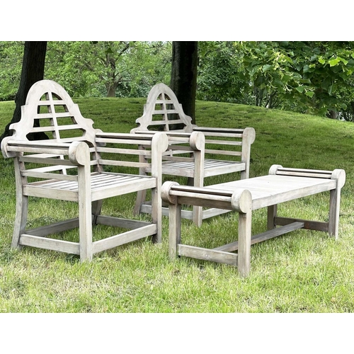 102 - LUTYENS STYLE GARDEN ARMCHAIRS AND TABLE, a pair, well weathered teak with companion low table all a... 