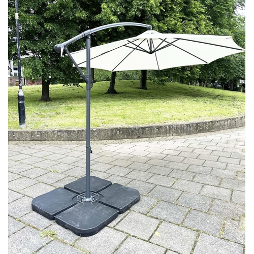 103 - SUN UMBRELLA, circular retractable with cantilever wind up support and weighted (water) bases.