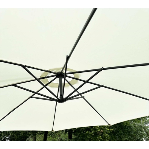 103 - SUN UMBRELLA, circular retractable with cantilever wind up support and weighted (water) bases.