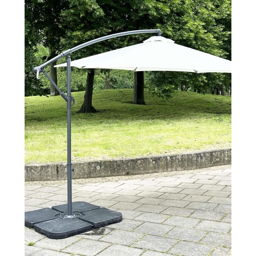 103 - SUN UMBRELLA, circular retractable with cantilever wind up support and weighted (water) bases.