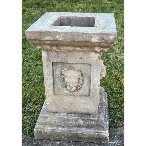 105 - GARDEN PLINTH/PLANTER, well weather reconstituted stone square form with lion mask detail and separa... 