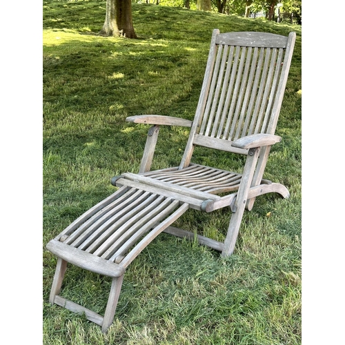 108 - GARDEN STEAMER CHAIR BY ALEXANDER ROSE, nicely weathered teak reclining with foot rest and cushions,... 