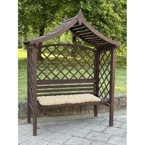 109 - GARDEN GAZEBO, vintage with pitched gable roof trellis back and slatted seat with cushion, 220cm H x... 