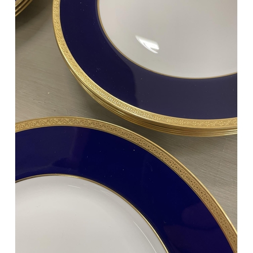 14 - WEDGWOOD BLUE PART DINNER SERVICE T GOODE AND CO LTD, cobalt blue banded with gold patterned trim, c... 