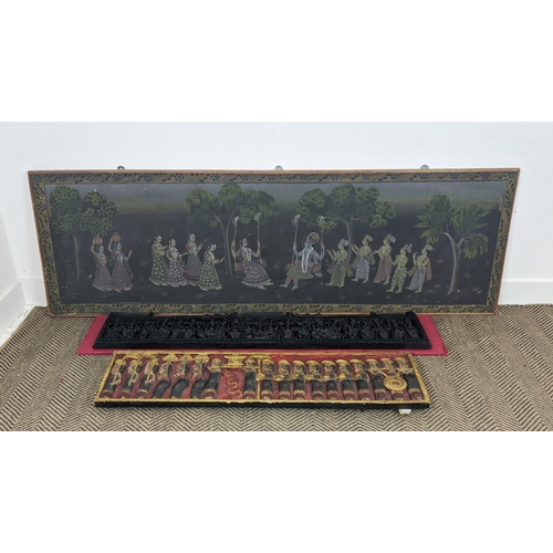 21 - GOUACHE ON PAPER, Indian figurative scene, 59cm x 182cm, an ebony carved panel on red silk, 24cm x 1... 