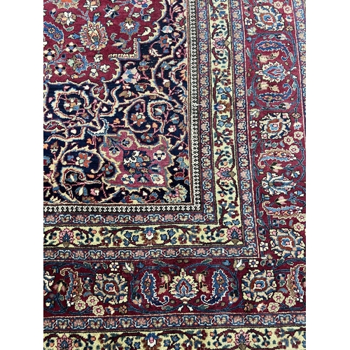 83 - PERSIAN MASHAD CARPET, 375cm x 305cm.