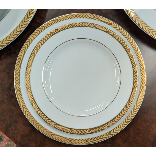 9 - DINNER SERVICE, twelve place setting with 24ct gold plated wreath border including side plates, teac... 