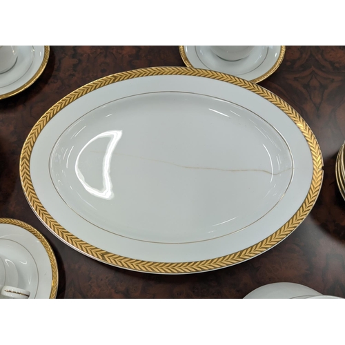 9 - DINNER SERVICE, twelve place setting with 24ct gold plated wreath border including side plates, teac... 