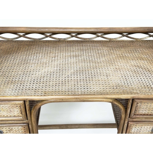 96 - BAMBOO WRITING TABLE BY 'Angraves' Leicester, rattan framed, wicker panelled and four short drawers,... 