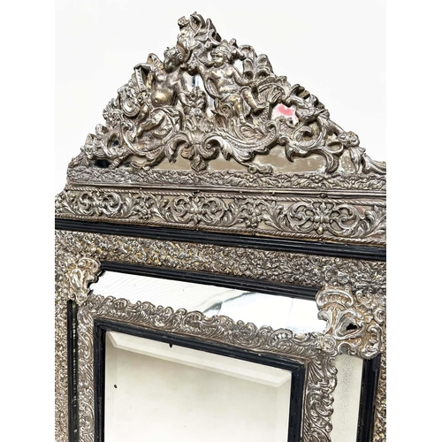 97 - WALL MIRROR, 19th century Flemish repoussé silvered metal and ebonised with cushion and bevelled mar... 