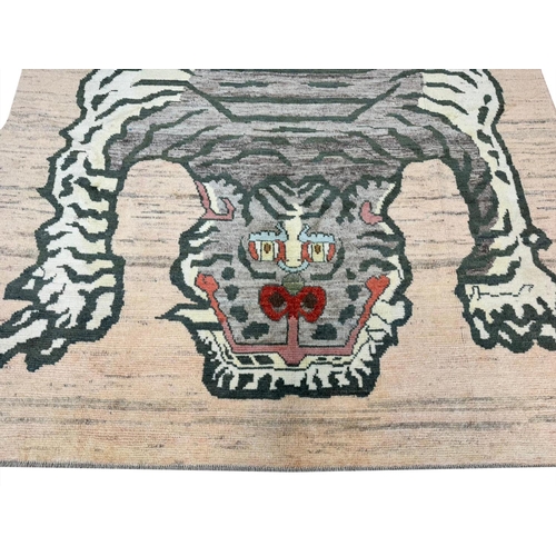 141 - FINE TIBETAN TIGER CARPET, 298cm x 205cm.