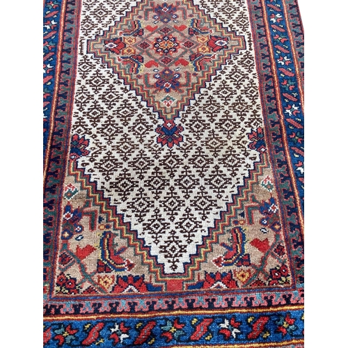 149 - ANTIQUE NORTH WEST PERSIAN SERAPI RUNNER, 535cm x 75cm.