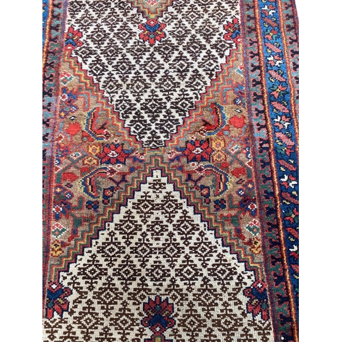 149 - ANTIQUE NORTH WEST PERSIAN SERAPI RUNNER, 535cm x 75cm.