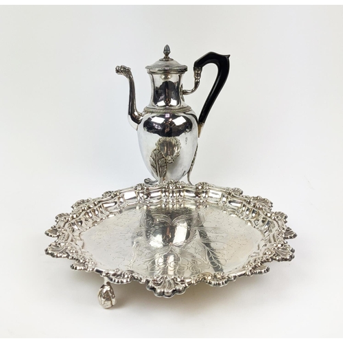 6 - A WHITE METAL HOT WATER POT, on three claw feet, together with a Rococo style salver on claw and bal... 